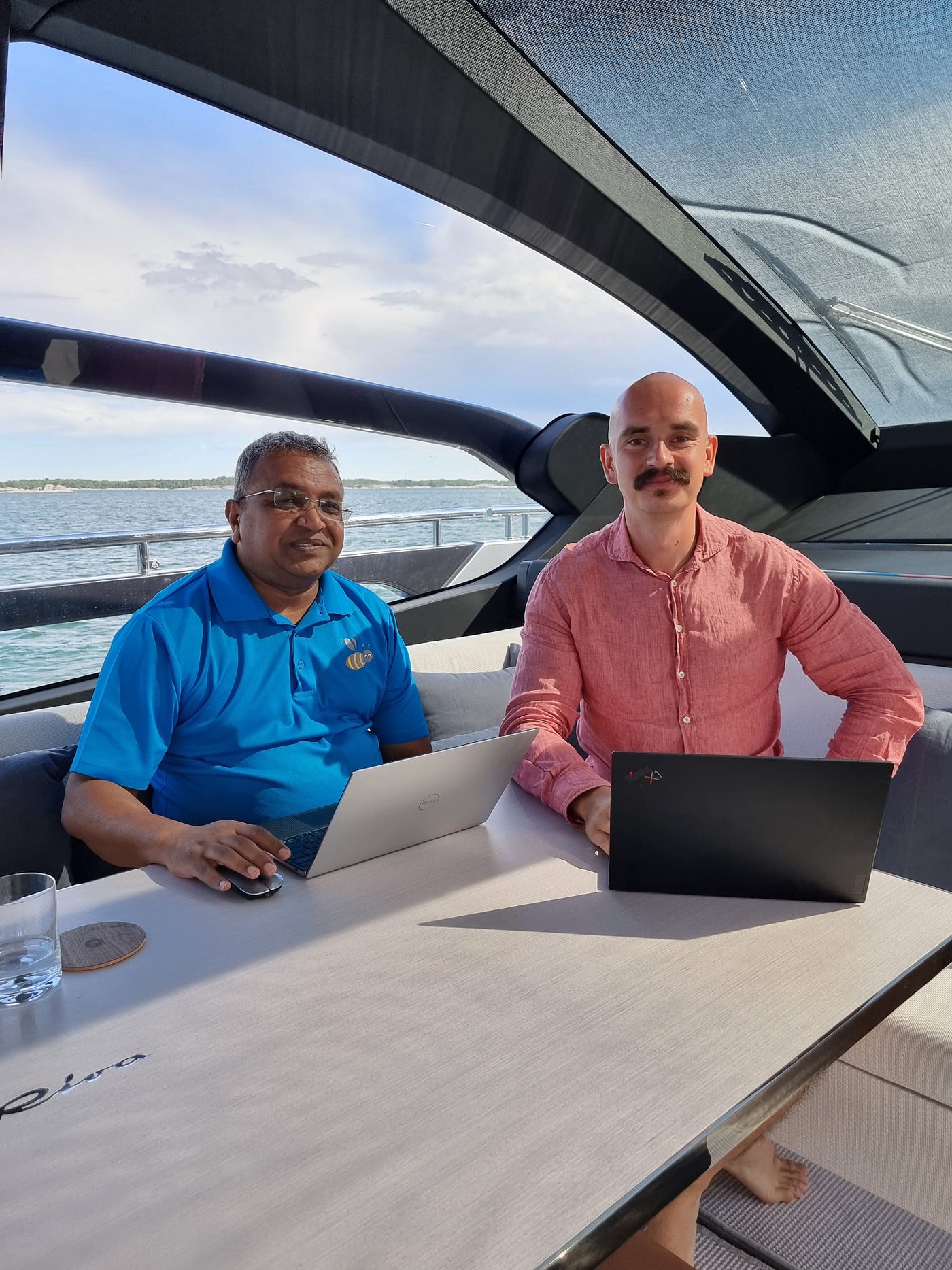 Successful traders discussing strategies on a yacht